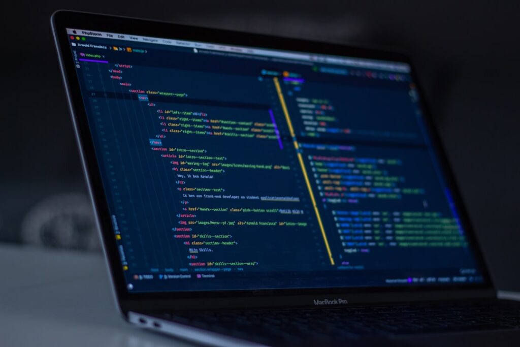 llm cost — turned-on MacBook Pro wit programming codes display