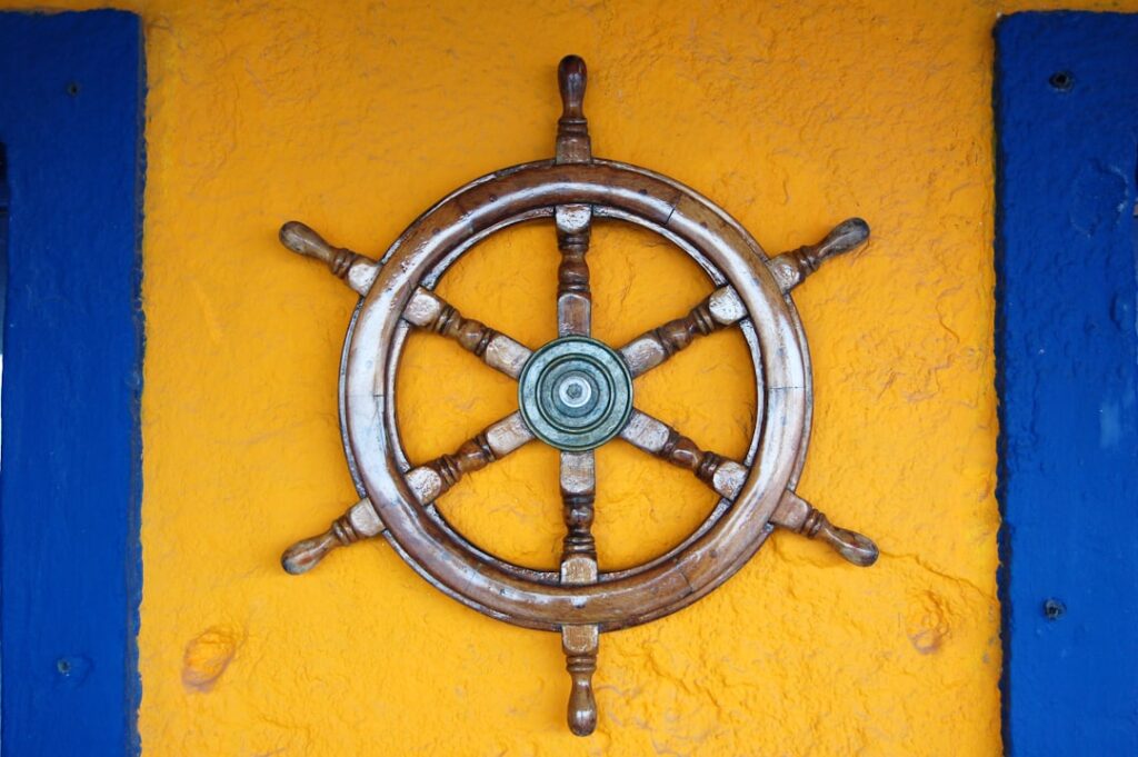 gateway api — brown ship helm on wall
