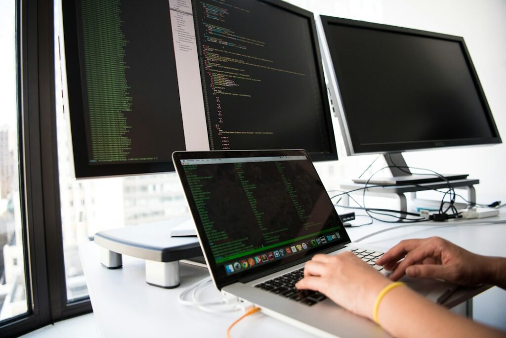 claude api — shallow focus photo of person using MacBook